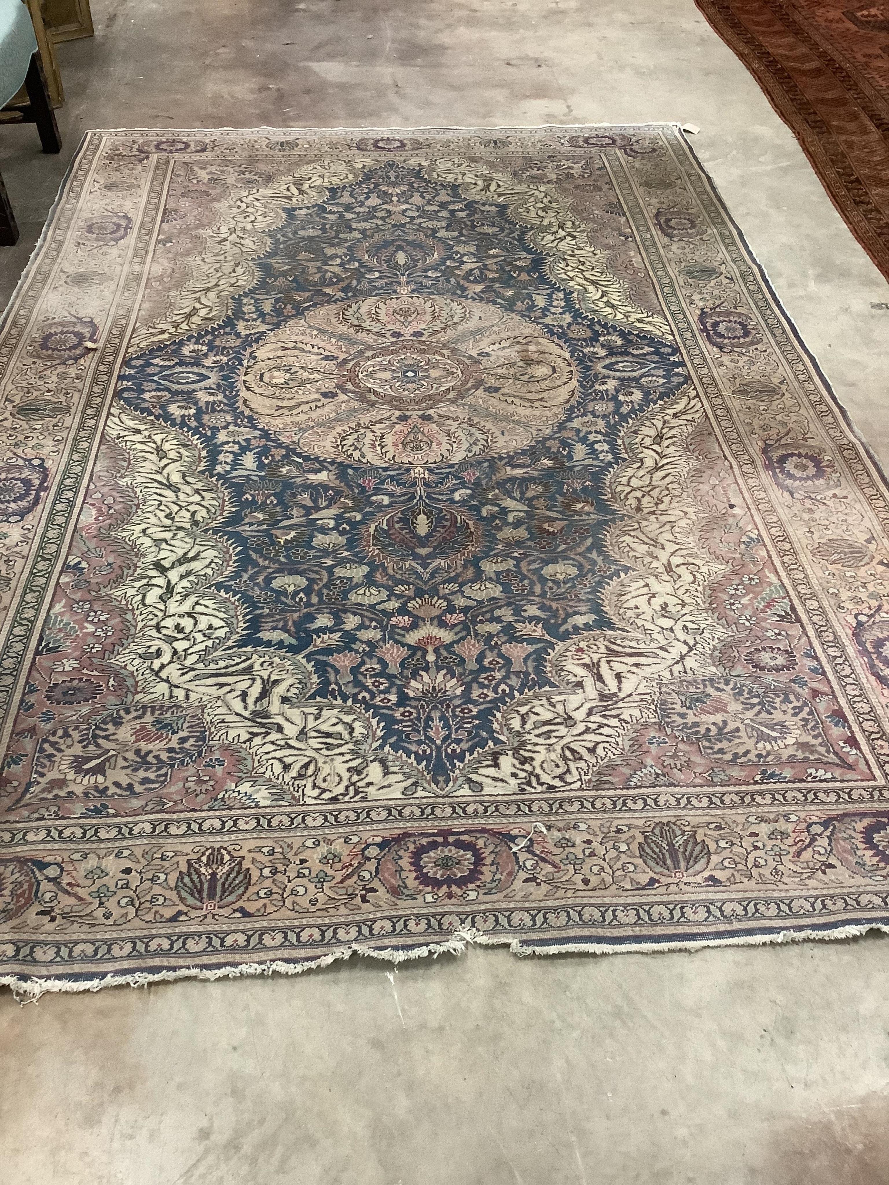 A North West Persian ivory ground carpet, 290 x 200cm. Condition - poor to fair